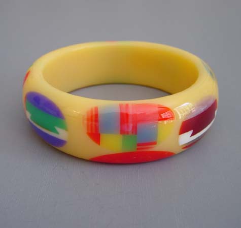 SHULTZ bakelite cream with multi-color dots and dovetails bangle