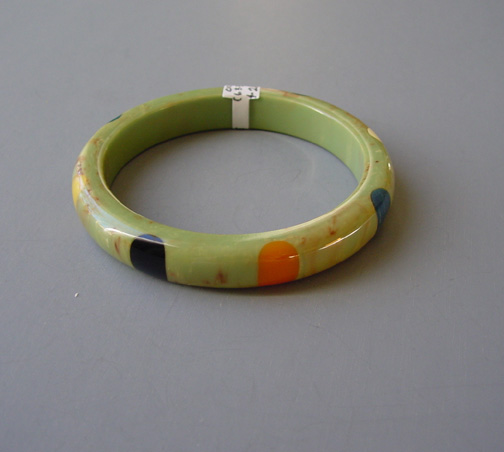 SHULTZ bakelite green swirled in cream and brown with round dots