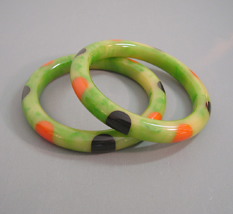 SHULTZ  bakelite green with cream marbling bangles with black and orange dots, set of 2