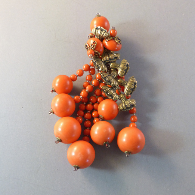 HASKELL Frank Hess early dress clip with carrot orange colored glass beads