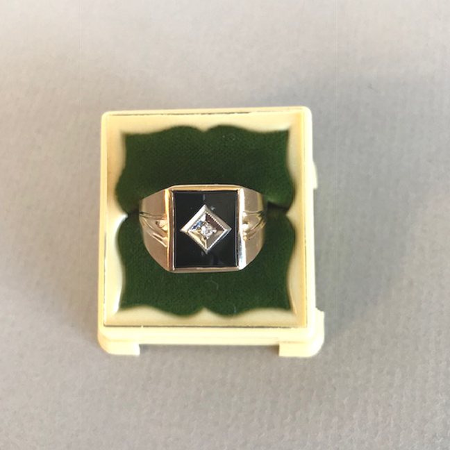 RING 10k yellow gold ring with a .02 single cut diamond set in black onyx