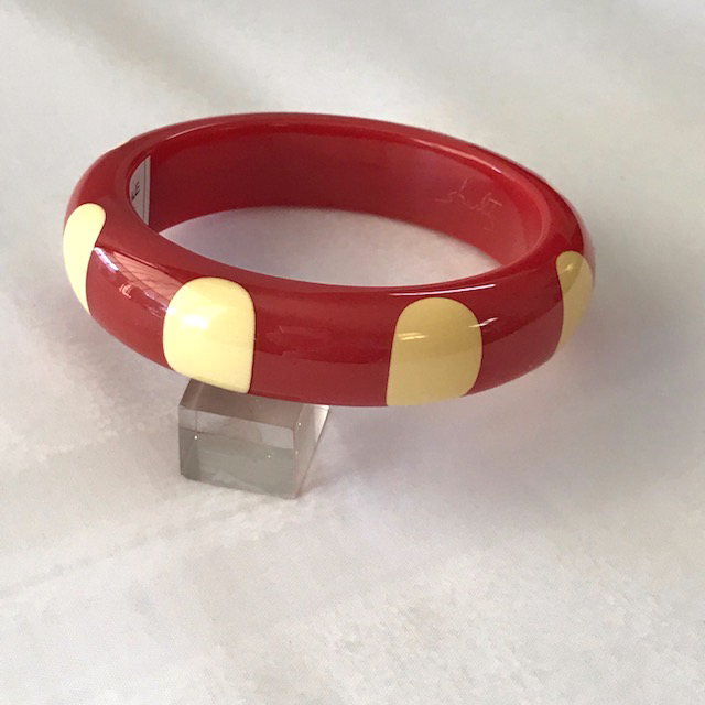 SHULTZ bakelite red bangle with 8 white finger nail dots