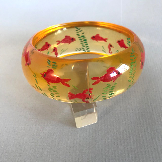 SHULTZ bakelite apple juice domed bangle with fun reverse carved and painted fish