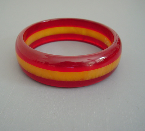 DOMBEK bakelite cherry red transparent and translucent butterscotch marbled laminated bangle