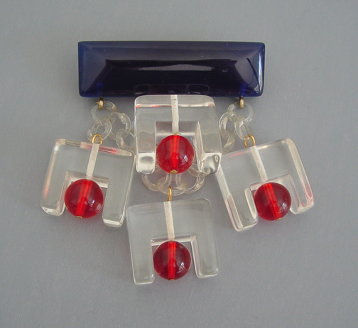SHULTZ bakelite and Lucite clear, transparent red and deep transparent blue dangles brooch