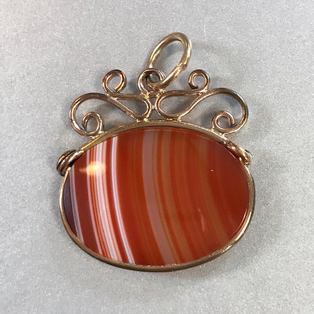 VICTORIAN watch fob, an agate with carnelian-colored and white stripes