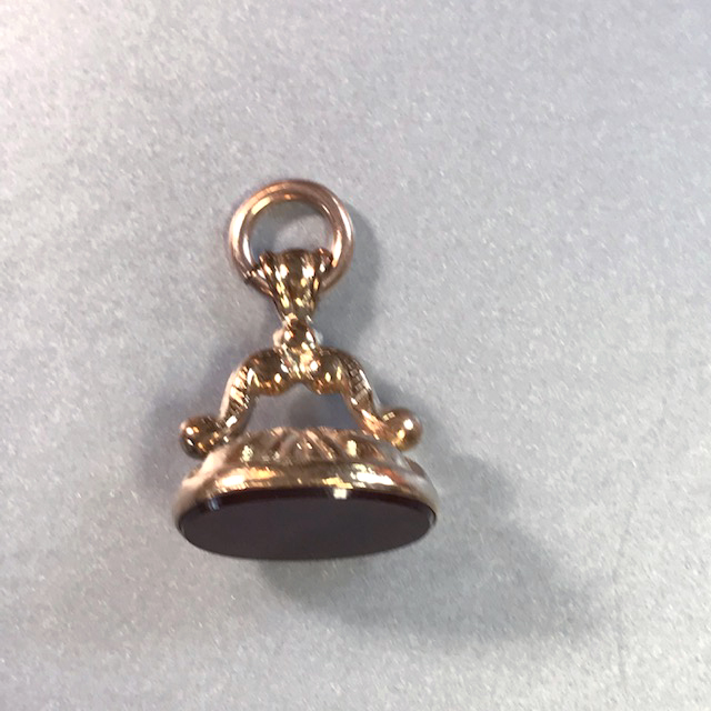 VICTORIAN gold tone wax seal watch fob with a smooth dark carnelian color agate
