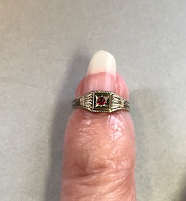 VICTORIAN 8 karat white gold tiny sized baby ring with a little round red stone