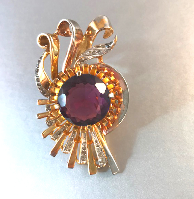 DEROSA fur clip with a Retro design and a large purple rhinestone center, 1941