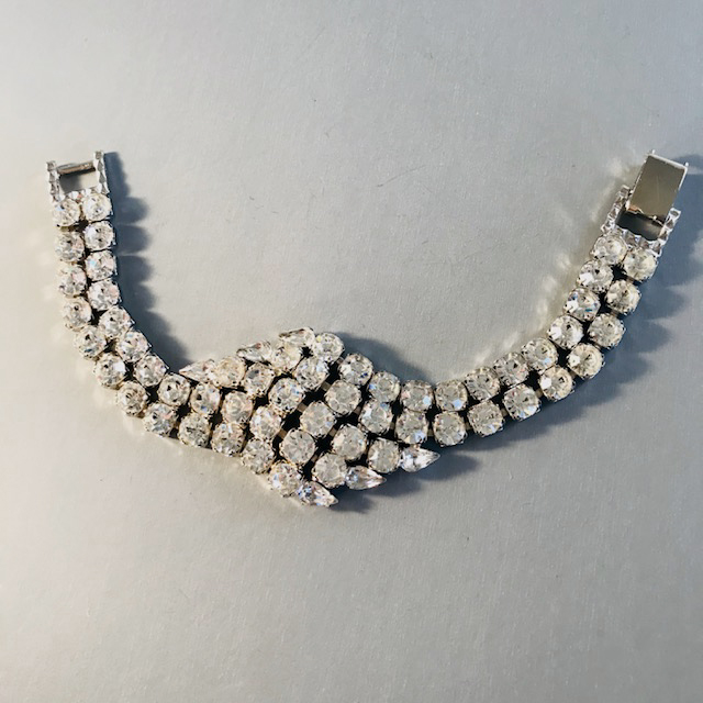 CLEAR rhinestone bracelet, wider at the front, set in silver tone metal