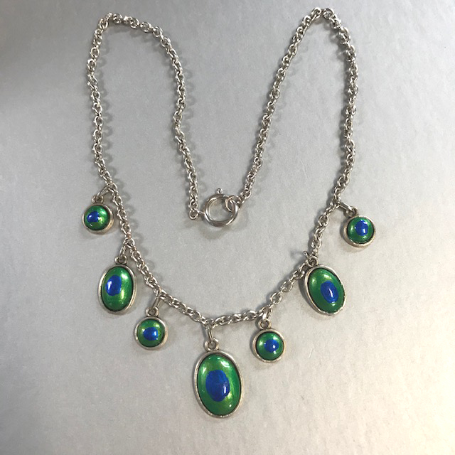 PEACOCK EYE style necklace with 7 eyes on a silver colored metal chain