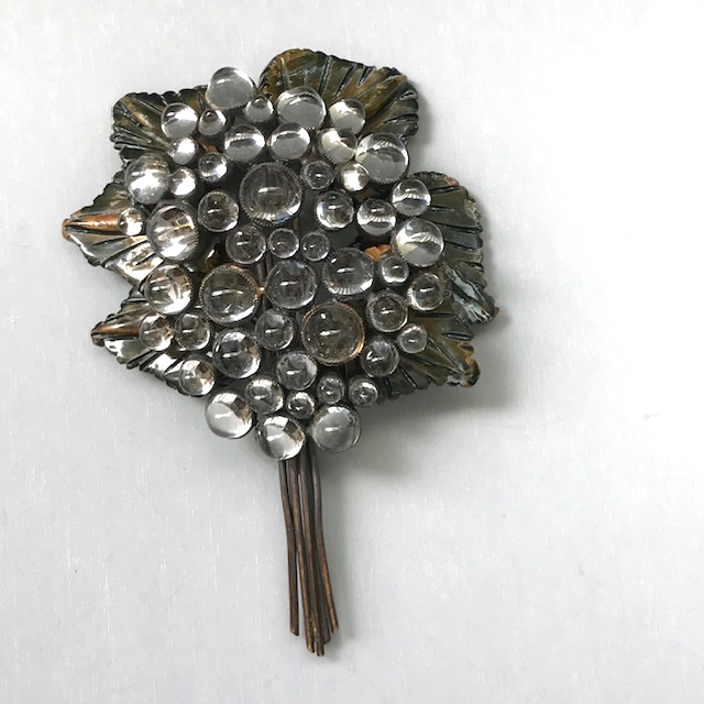 RAINDROPS bouquet brooch with clear bullet glass cabochons and darker washed bakelite leaves in the style of Blumenthal
