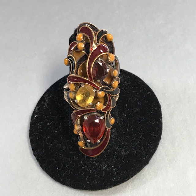 VEGA MADDUX  ring with two faceted quartz brown and one yellow stones set among yellow, brown and black enamel