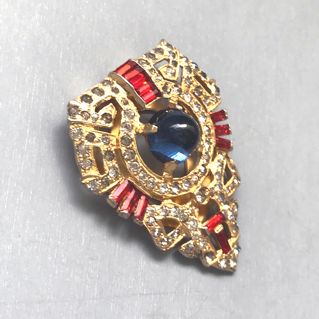 DEROSA dress clip with a blue cabochon center, red baguettes and clear rhinestones in patriotic colors