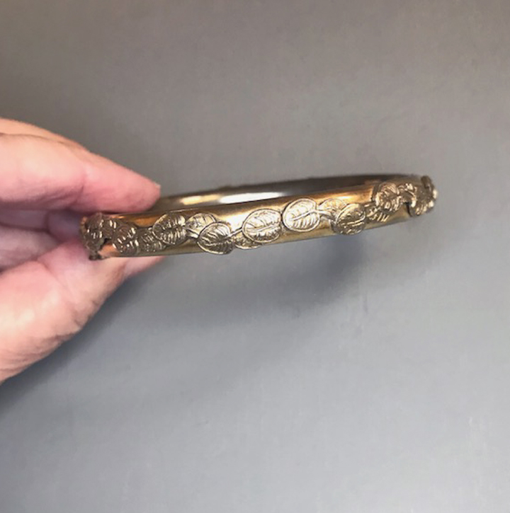 SANDOR hinged bangle bracelet in gold tone metal with applied leaves