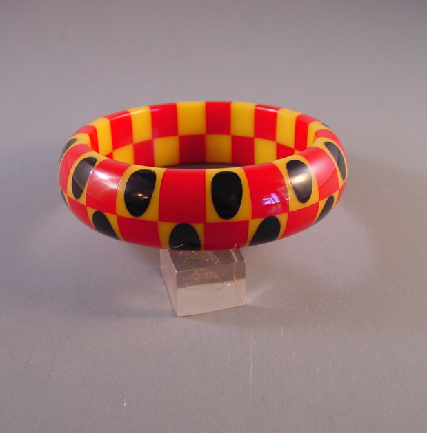 SHULTZ red and yellow two row checked bangle with black dots