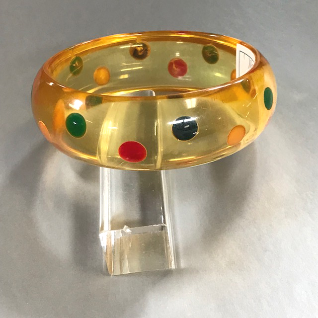 SHULTZ bakelite apple juice bangle with dots in red, green, yellow, and dark blue