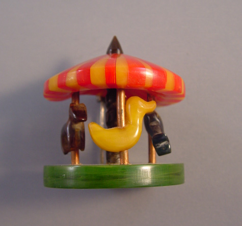 ADRIAN rare bakelite carousel brooch in red, butterscotch, green and dark brown OOAK