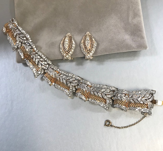 DEROSA bracelet and earrings in clear rhinestones set into gold and silver tone metal filigree