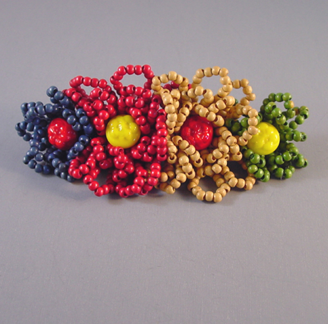 MIRIAM HASKELL by Frank Hess rare beaded flowers brooch in red, blue, green and yellow wood and glass beads, the primary colors right out of a Crayon box