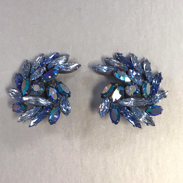 REGENCY earrings with a swirling design using pastel blue and blue aurora borealis rhinestones