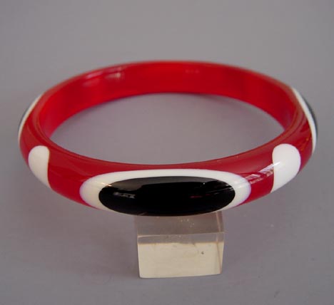 SHULTZ bakelite bangle in cherry red transparent with black and white double Belle Kogan oval dots