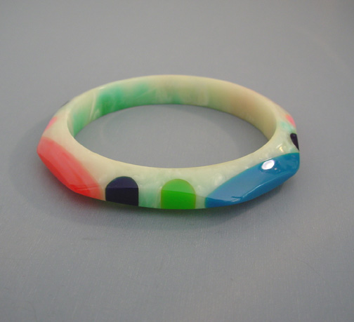 SHULTZ bakelite pastel green and cream marbled octagonal bangle with oval and round dots in red, pink, blue, green and black