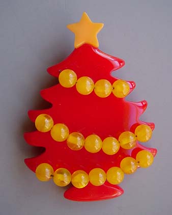 SHULTZ bakelite red Christmas tree pin with yellow top star and ornaments