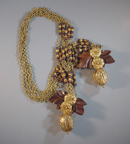 MIRIAM HASKELL by Frank Hess lariat necklace with carved wood leaves, gold painted walnuts and gold tone metal flowers