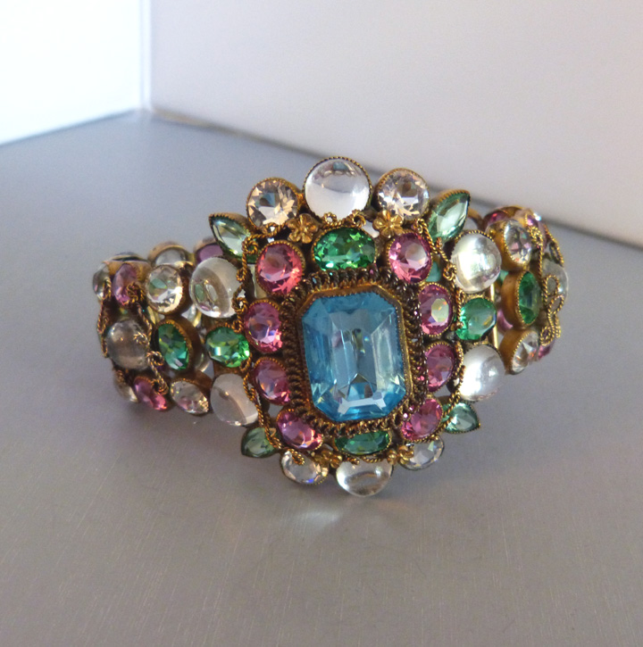 HOBE bracelet with a large aqua unfoiled center rhinestone surrounded by pink and green rhinestones and clear cabochons