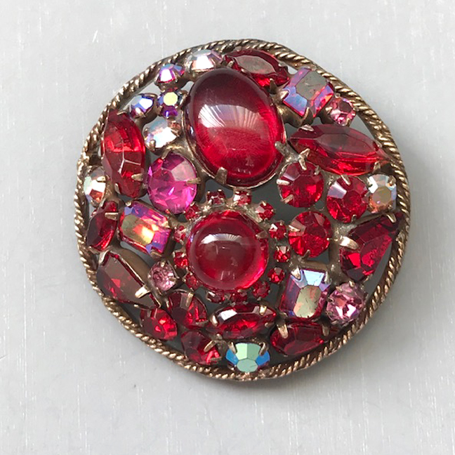RED and aurora borealis rhinestones and cabochons round brooch in a gold tone setting
