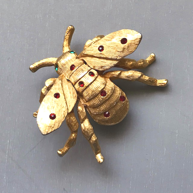 DENICOLA fly or bug brooch with red rhinestones and green rhinestone eyes