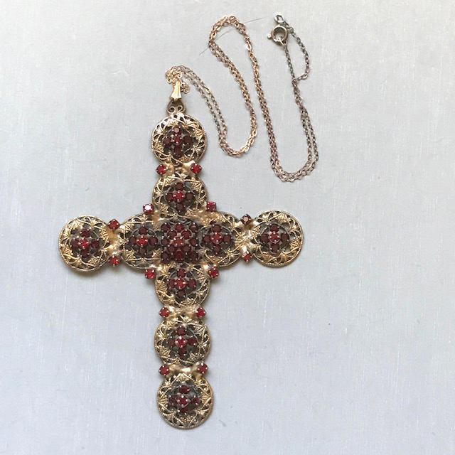 HOBE cross pendant of rich red garnet colored faceted rhinestones in an antiqued gold tone filigree