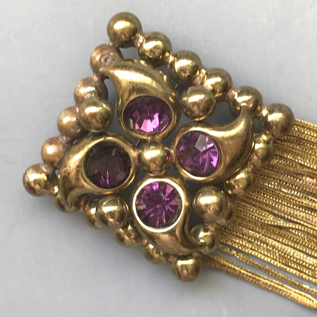 PURPLE rhinestones and gold tone metal brooch with chain fringes along the bottom, 5″ long