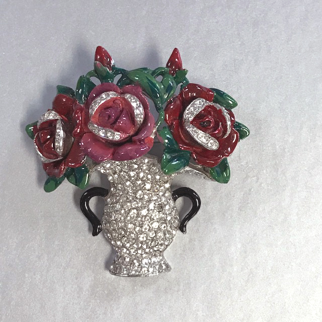 DEJA vase brooch of lush red enameled roses in a clear rhinestone pave vase