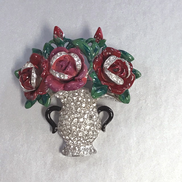 DEJA vase brooch of lush red enameled roses in a clear rhinestone pave vase