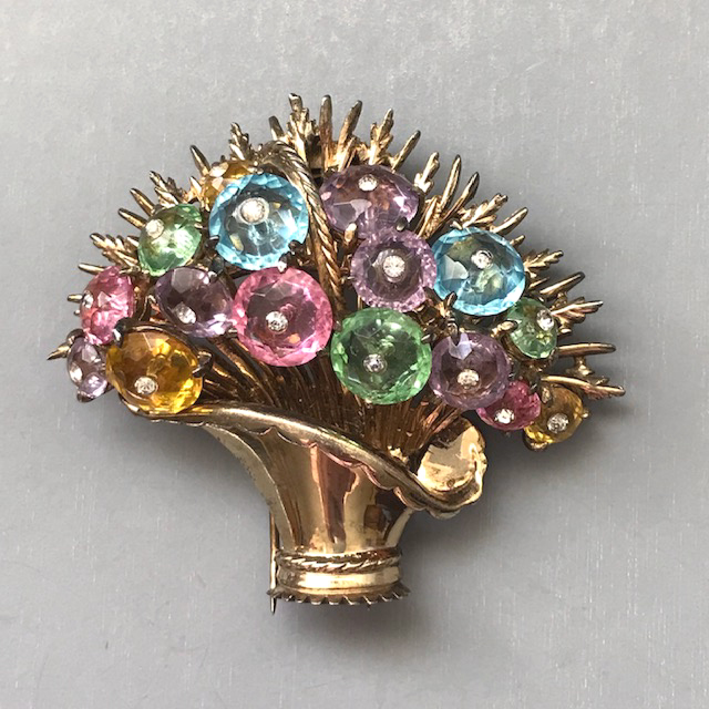 DEROSA basket of flowers fur clip with pastel faceted glass lozenges as flowers, each centered with a little clear rhinestone
