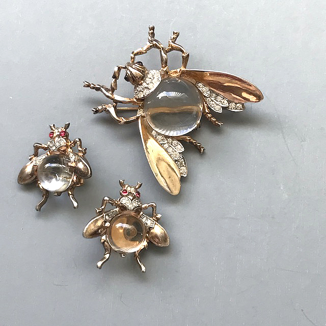 TRIFARI jelly belly fly set of a Lucite body brooch and clip back earrings with clear rhinestone accents and red rhinestone eyes