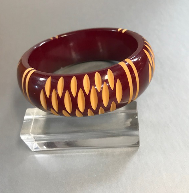 BAKELITE maroon washed bangle that is cut through to butterscotch