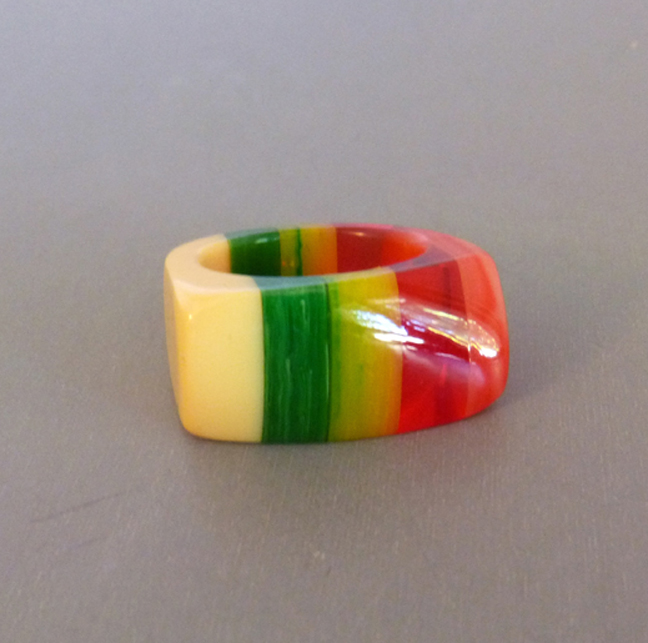 SHULTZ cream colored bakelite ring with stripes of rose, transparent red, marbled yellow and green, made 2005