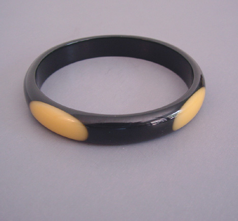 SHULTZ bakelite black spacer bangle with 4 oval butter yellow dots