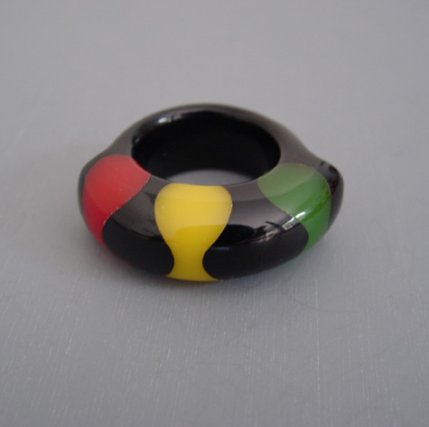 SHULTZ bakelite black bowtie ring with red, green and yellow bowtie dots