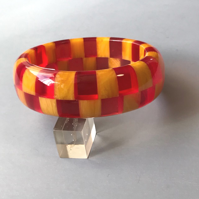 SHULTZ two-row check bangle in wonderful colors of transparent red and marbled tangerine orange