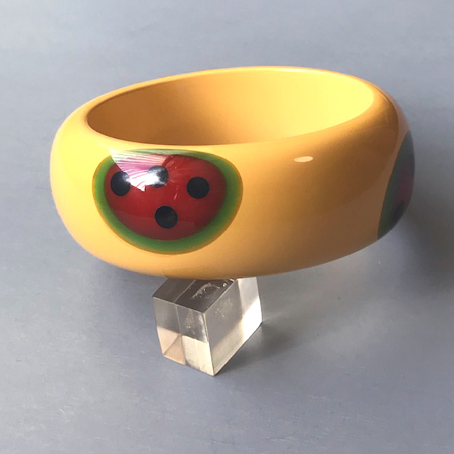 SHULTZ bakelite chunky watermelon bangle in cream with four red, green and black watermelon slice dots