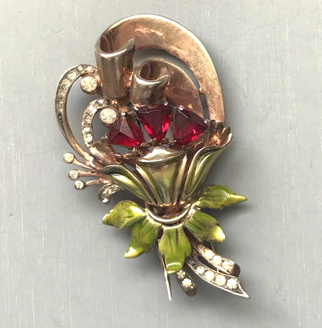 DEROSA fur clip with a red and clear rhinestone flower and green enameled leaves in a gold washed sterling setting