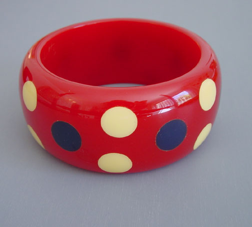 SHULTZ bakelite apple red bangle with cream and navy blue round dots