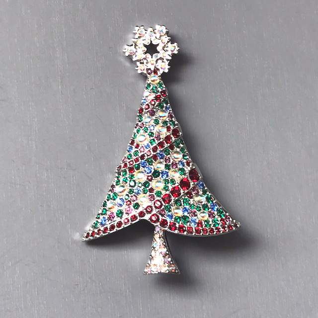 SWAROVSKI Rockefeller 2004 Christmas tree brooch with red, blue and green boughs, red rhinestone garland
