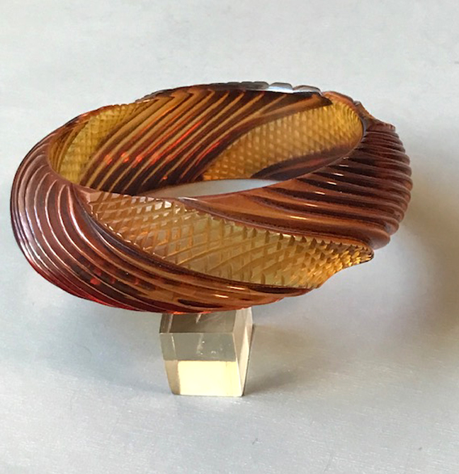 BAKELITE well carved root beer cut back to apple juice bangle with cross hatch and diagonal carving