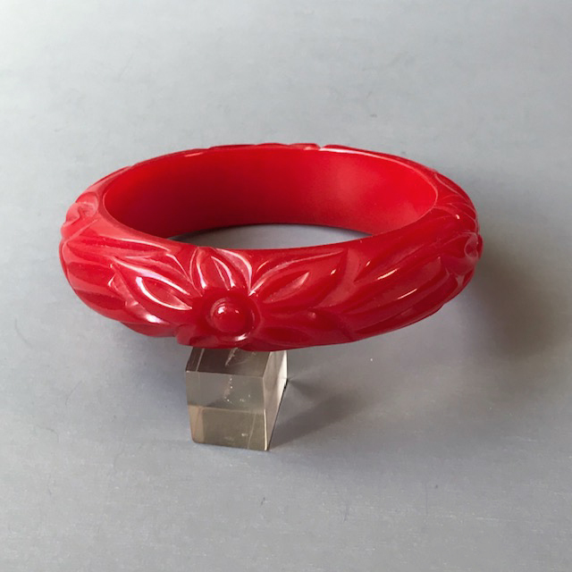 BAKELITE bright cherry red bangle with carved and tumbled flowers and leaves