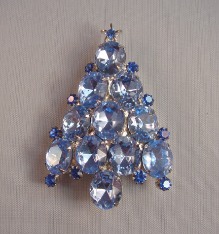 ATTRUIA Christmas tree brooch with pastel blue rhinestones